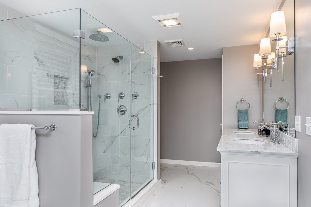 15 Carlton Road Marblehead, MA 01945 - Photo 20 of 37 a bathroom with a double vanity sink mirror and shower