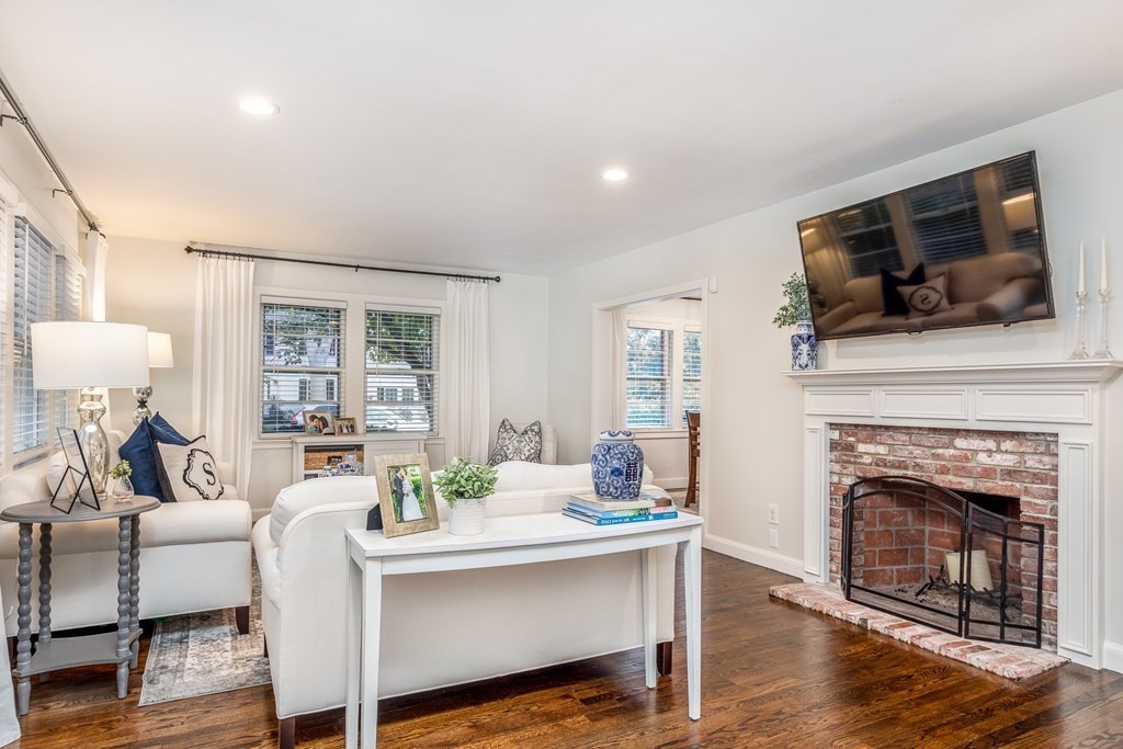 15 Carlton Road Marblehead, MA 01945 - Photo 3 of 37 a living room with furniture a flat screen tv and a fireplace