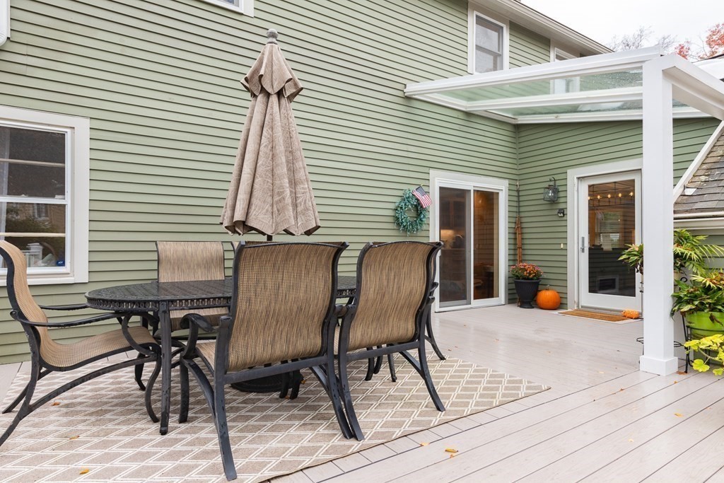 15 Carlton Road Marblehead, MA 01945 - Photo 31 of 37 a view of a patio with table and chairs and wooden floor