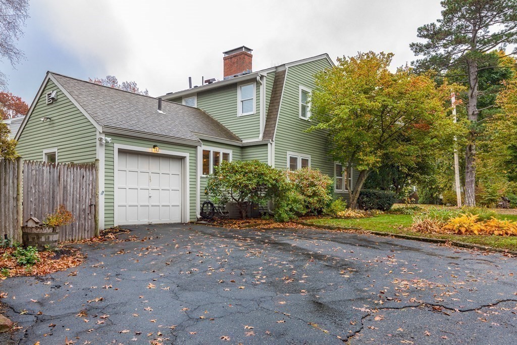 15 Carlton Road Marblehead, MA 01945 - Photo 36 of 37 a front view of a house with a yard and garage