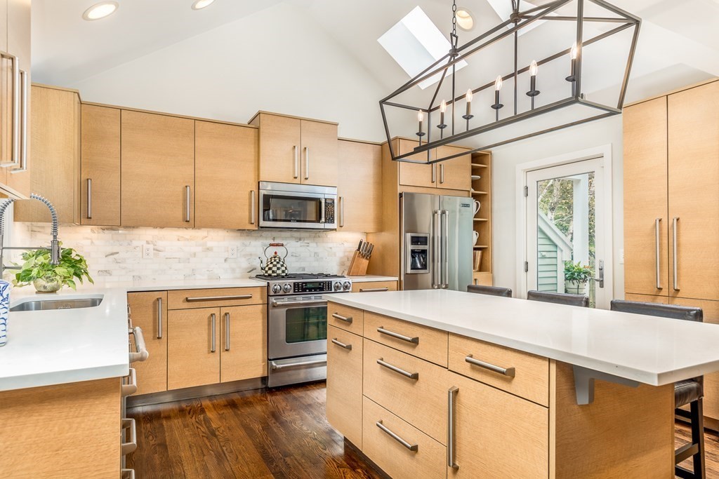 15 Carlton Road Marblehead, MA 01945 - Photo 6 of 37 a kitchen with stainless steel appliances granite countertop a stove a sink and a refrigerator