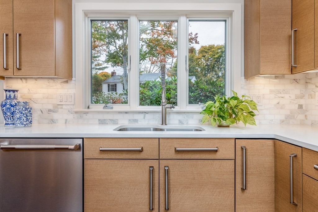 15 Carlton Road Marblehead, MA 01945 - Photo 7 of 37 a kitchen with stainless steel appliances granite countertop a sink a window and a granite counter tops