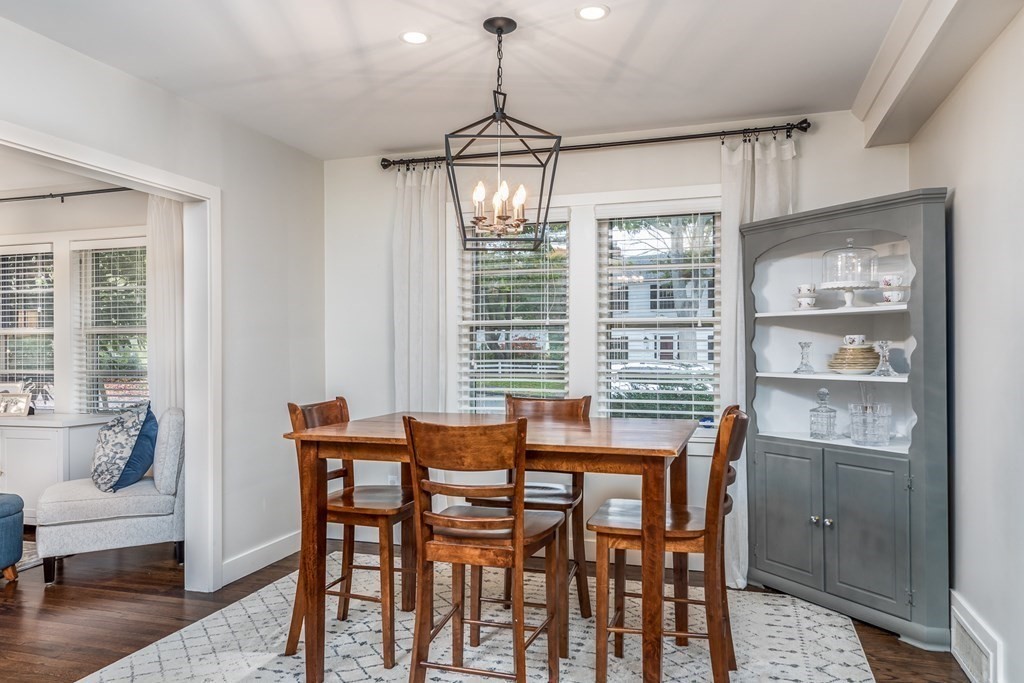 15 Carlton Road Marblehead, MA 01945 - Photo 10 of 37 a dining room with furniture a chandelier and wooden floor