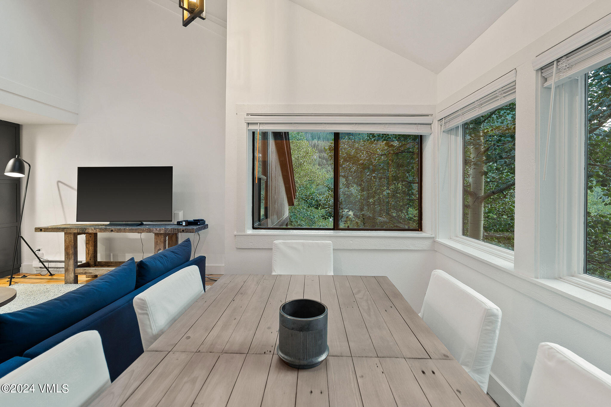 3094 Booth Falls Road, Unit 14 Vail, CO 81657 - Photo 11 of 36 a living room with a couch and a flat screen tv