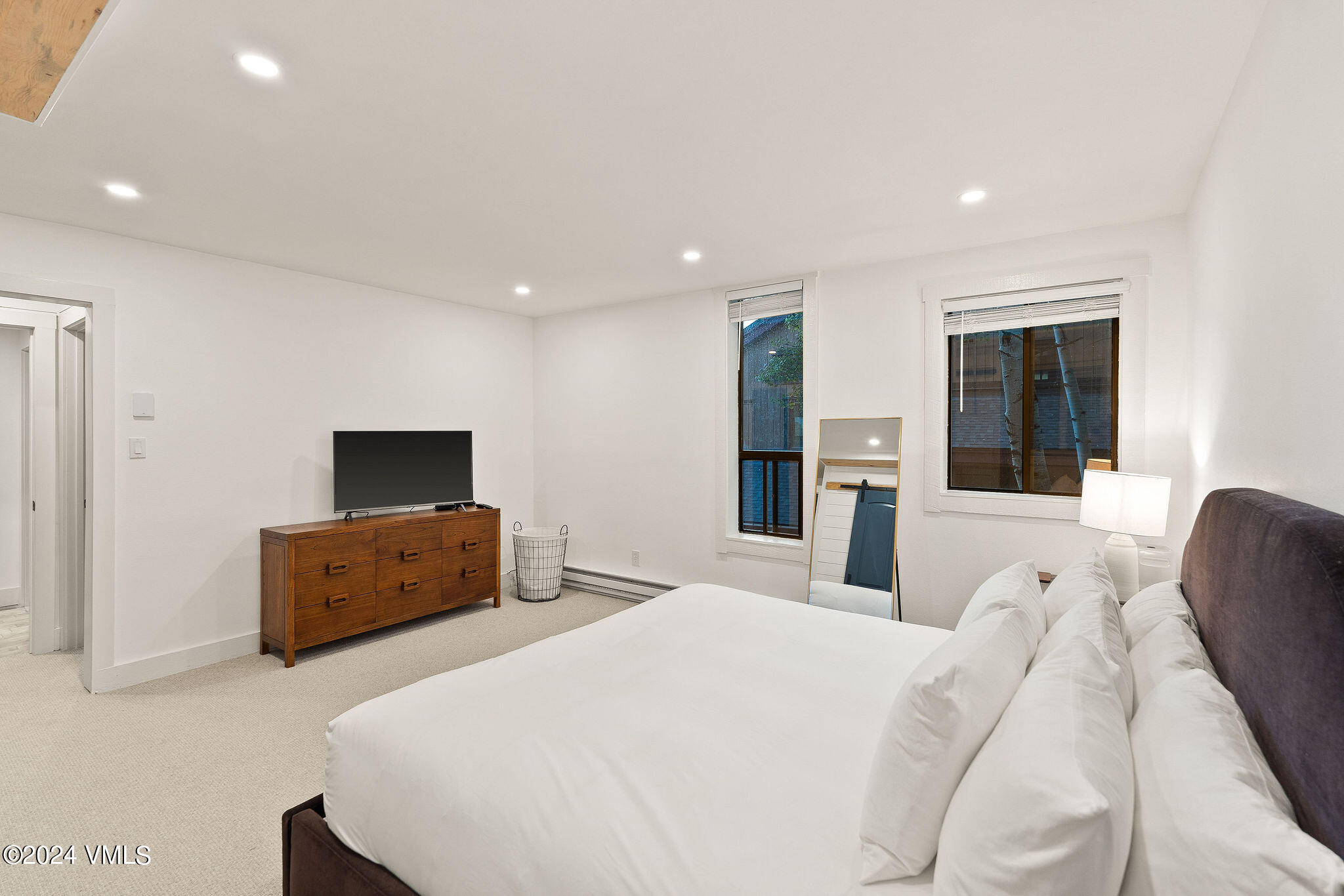 3094 Booth Falls Road, Unit 14 Vail, CO 81657 - Photo 12 of 36 a bedroom with furniture and a flat screen tv