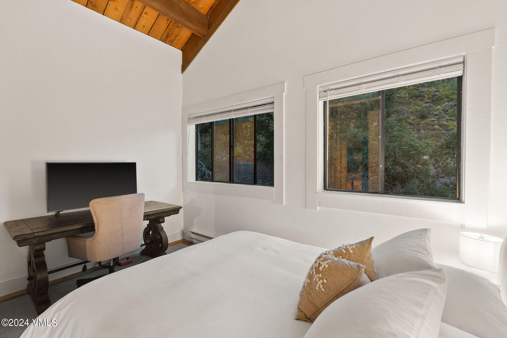 3094 Booth Falls Road, Unit 14 Vail, CO 81657 - Photo 14 of 36 a bedroom with furniture and a window