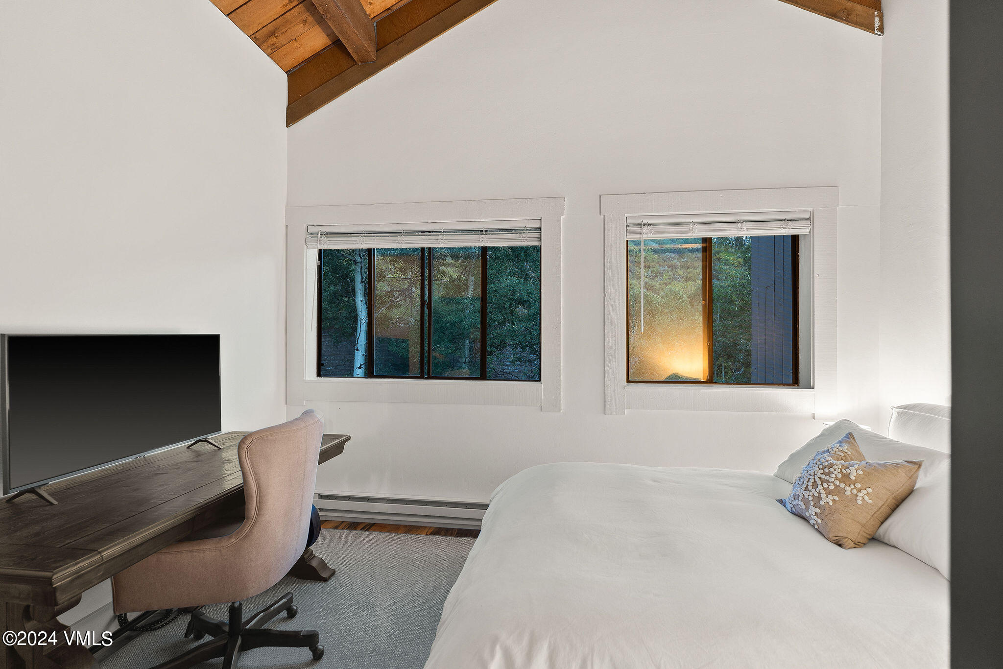 3094 Booth Falls Road, Unit 14 Vail, CO 81657 - Photo 15 of 36 a bedroom with a bed and window