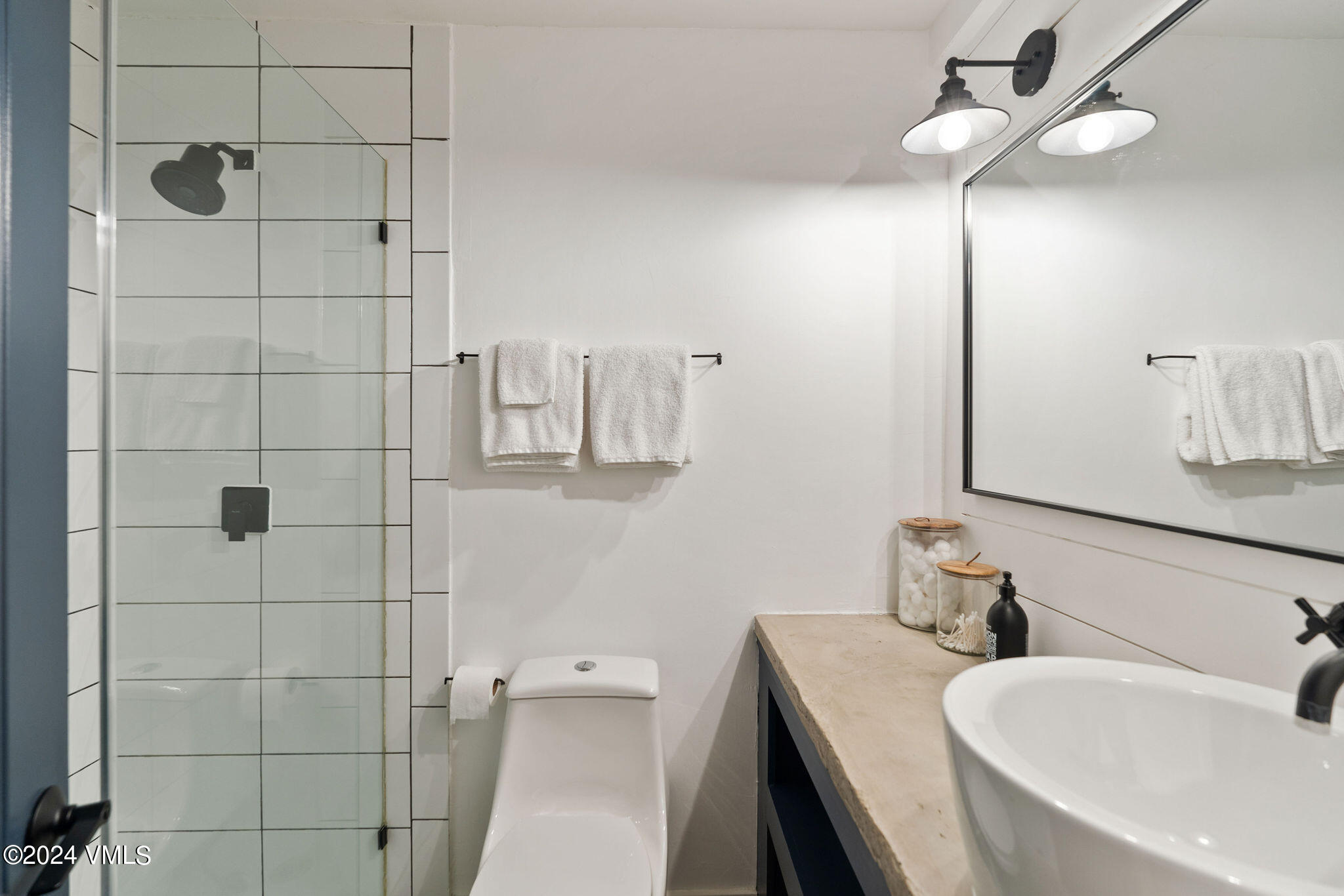 3094 Booth Falls Road, Unit 14 Vail, CO 81657 - Photo 23 of 36 a bathroom with a sink a toilet and shower