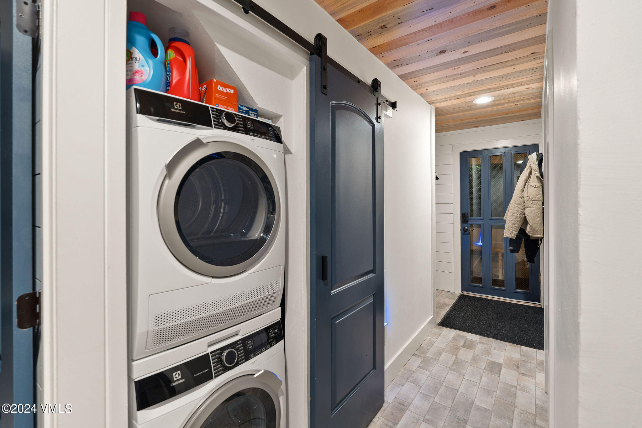 3094 Booth Falls Road, Unit 14 Vail, CO 81657 - Photo 25 of 36 a view of a hallway with washer and dryer
