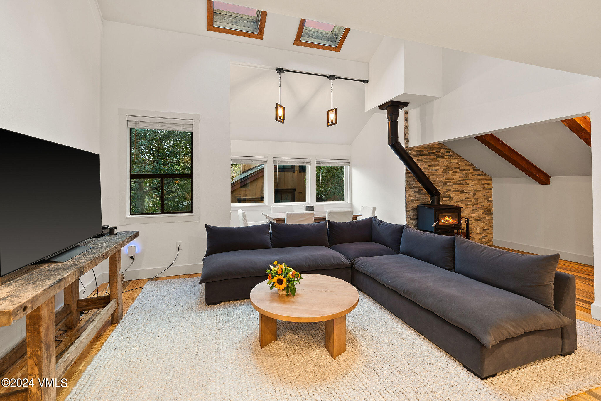 3094 Booth Falls Road, Unit 14 Vail, CO 81657 - Photo 5 of 36 a living room with furniture and a flat screen tv