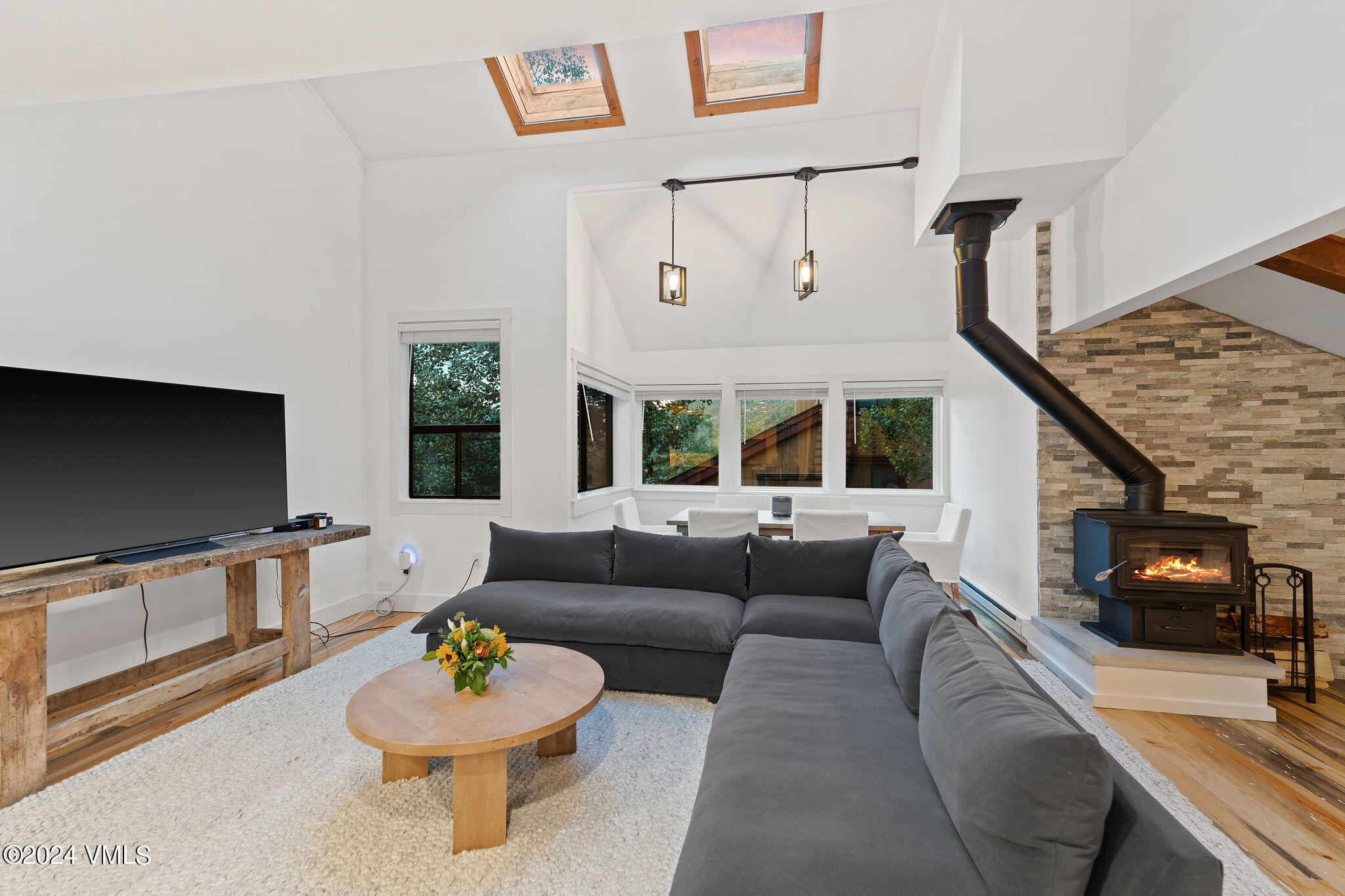 3094 Booth Falls Road, Unit 14 Vail, CO 81657 - Photo 6 of 36 a living room with furniture and a flat screen tv