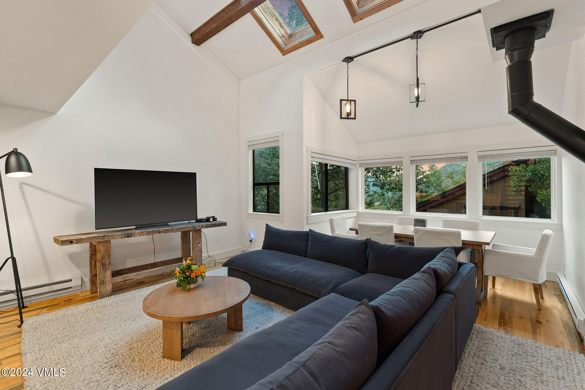 3094 Booth Falls Road, Unit 14 Vail, CO 81657 - Photo 7 of 36 a living room with furniture and a flat screen tv
