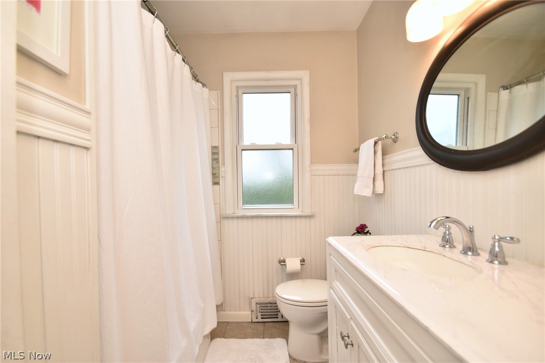 1174 Haverston Road Cleveland, OH 44124 - Photo 13 of 21 Bathroom with tile floors, oversized vanity, and toilet