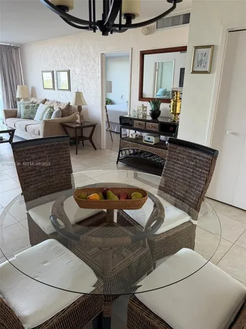 a view of a chairs and table in patio