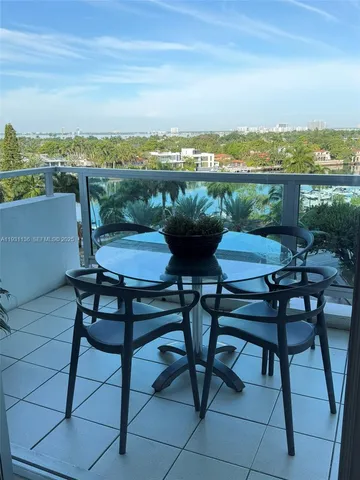 a view of ocean with a palm tree