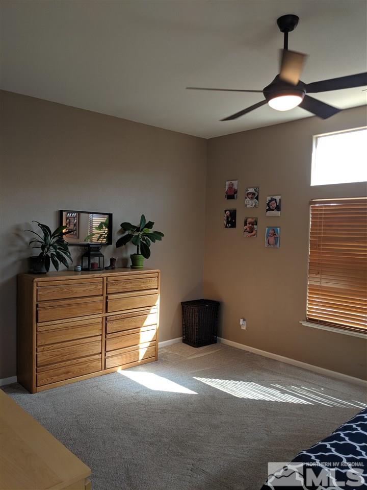 420 Pesaro Way Reno, NV 89521 - Photo 13 of 25 a view of empty room with window and ceiling fan