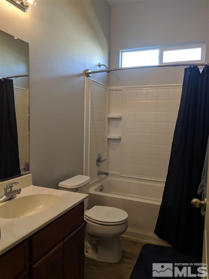 420 Pesaro Way Reno, NV 89521 - Photo 19 of 25 a bathroom with a sink a toilet and shower