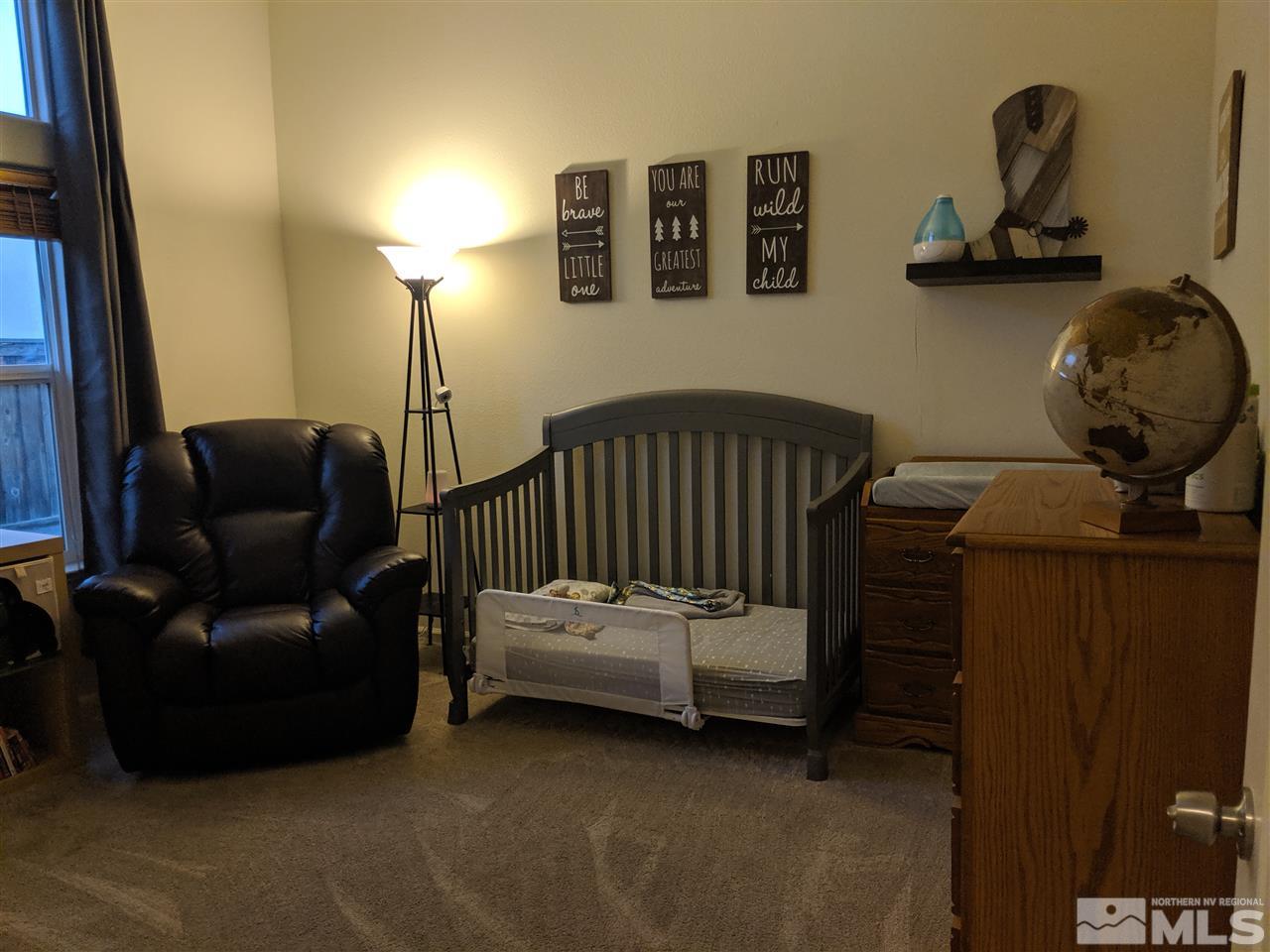 420 Pesaro Way Reno, NV 89521 - Photo 20 of 25 a bedroom with furniture and a window