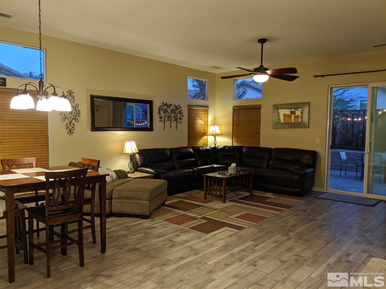 420 Pesaro Way Reno, NV 89521 - Photo 5 of 25 a living room with furniture and a chandelier