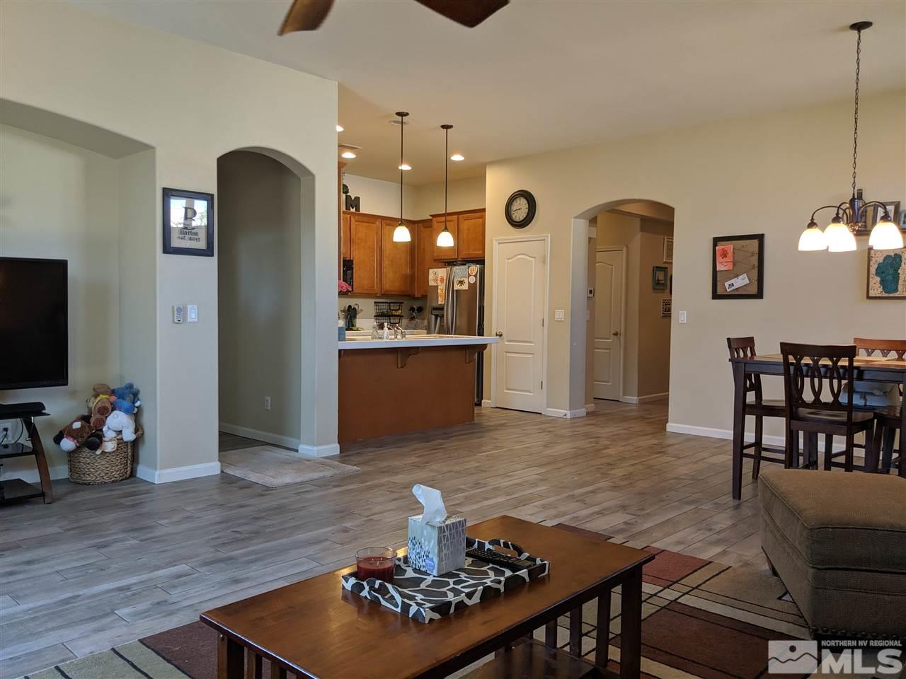420 Pesaro Way Reno, NV 89521 - Photo 8 of 25 a living room with furniture wooden floor and a flat screen tv