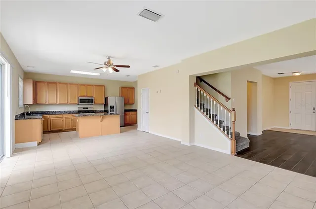 a view of kitchen and kitchen with sink