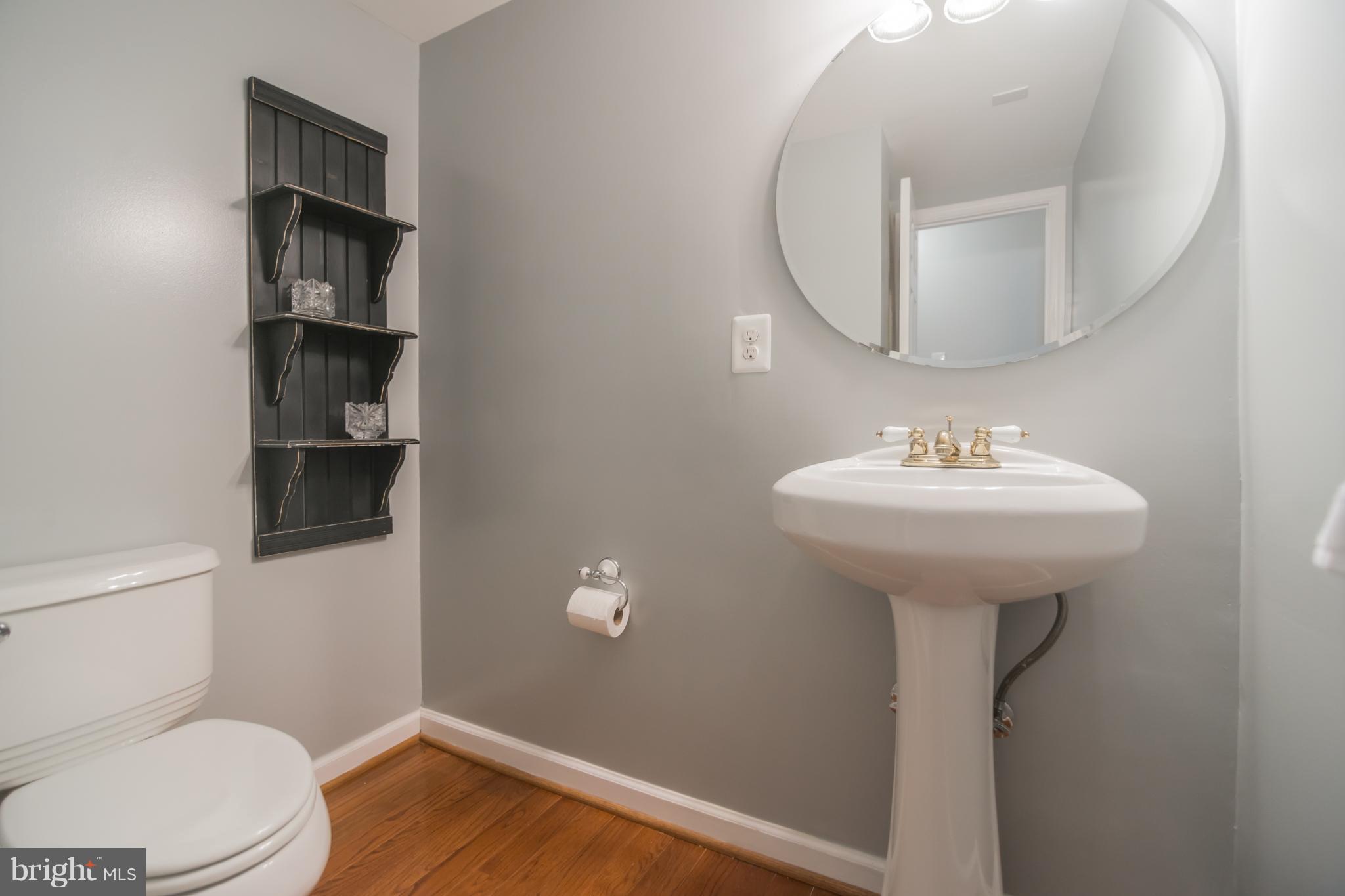 709 North York Road Sterling, VA 20164 - Photo 22 of 27 Main Level Bathroom w/Pedestal Sink, Hardwood Flrs