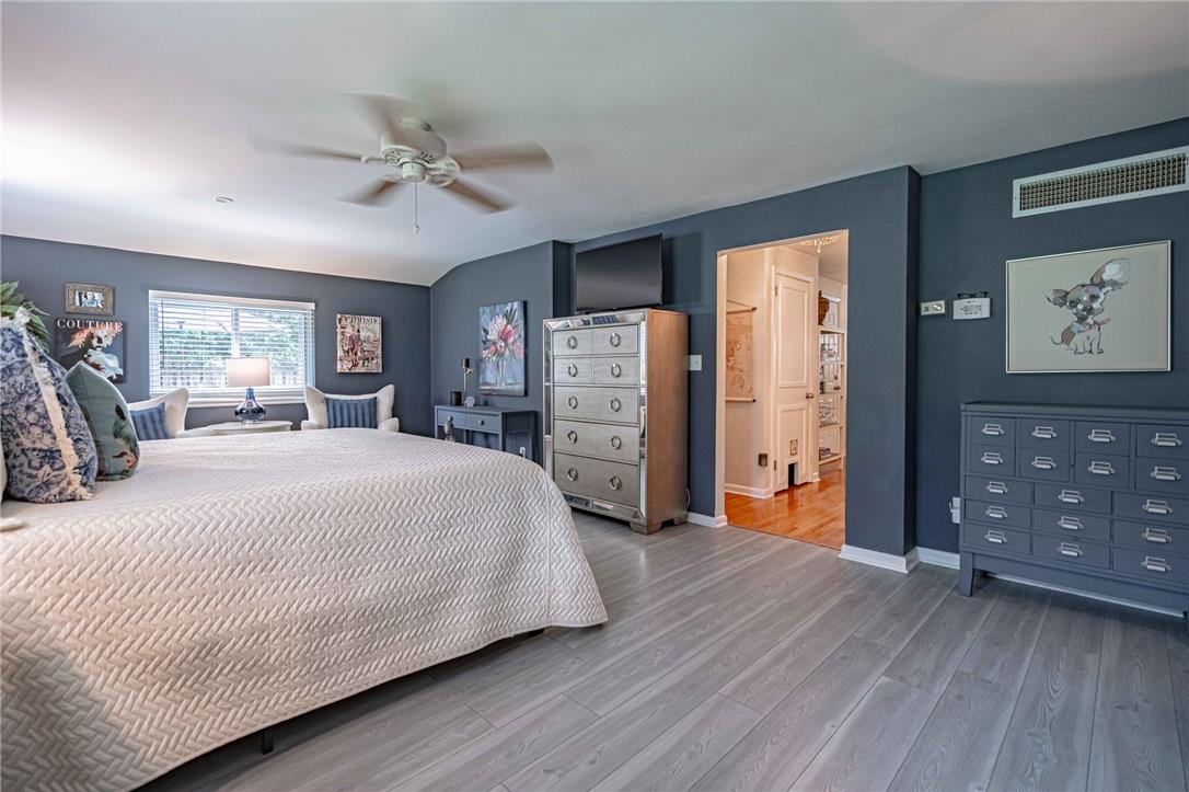 2741 West Livingston Street Allentown, PA 18104 - Photo 29 of 51 A tranquil bedroom features rich tones, elegant flooring, and a large window inviting natural light.