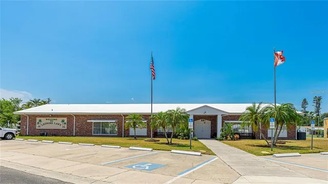 a view of a patio with a table and chairs