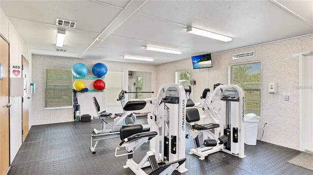 a kitchen with stainless steel appliances a sink and wooden cabinets