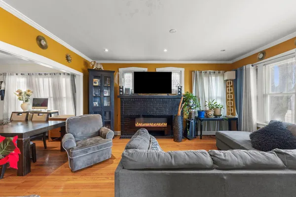 a living room with furniture and a fireplace