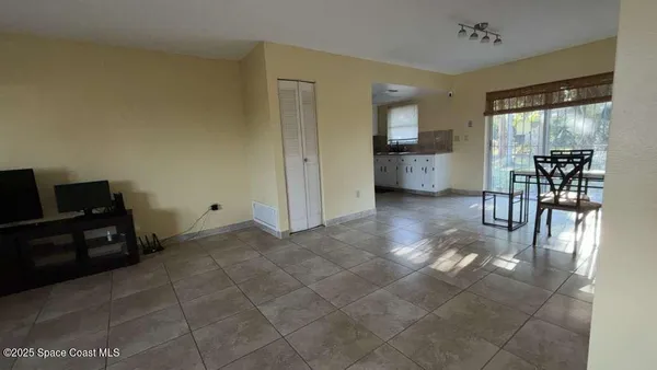 a view of kitchen with furniture and window