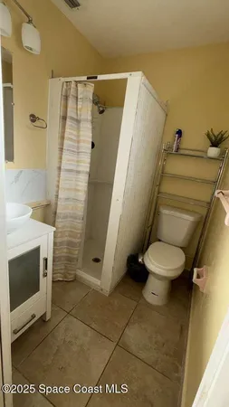 a bathroom with a sink and toilet