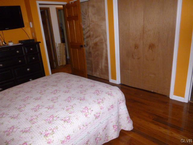 268 Sundance Road Effort, PA 18330 - Photo 18 of 28 a bedroom with a bed and wooden floor