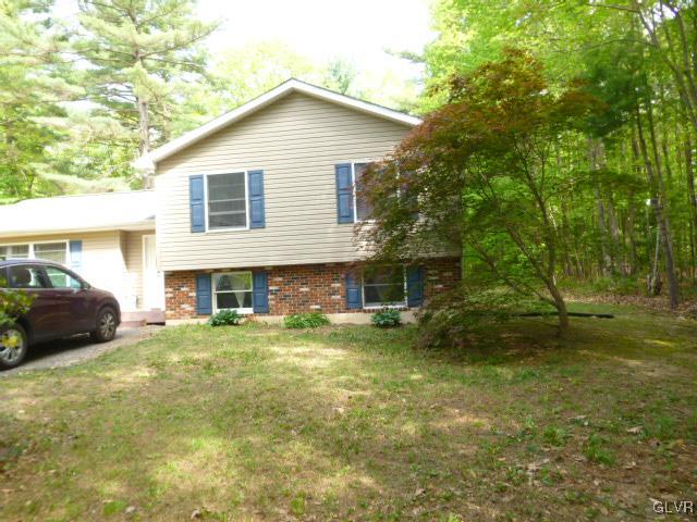 268 Sundance Road Effort, PA 18330 - Photo 2 of 28 a view of a house with a patio and a yard