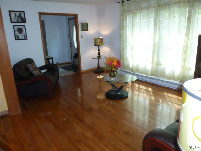 268 Sundance Road Effort, PA 18330 - Photo 5 of 28 a living room with furniture and a wooden floor