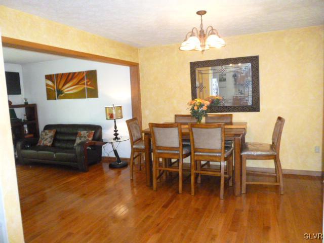 268 Sundance Road Effort, PA 18330 - Photo 8 of 28 a dining room with furniture and wooden floor