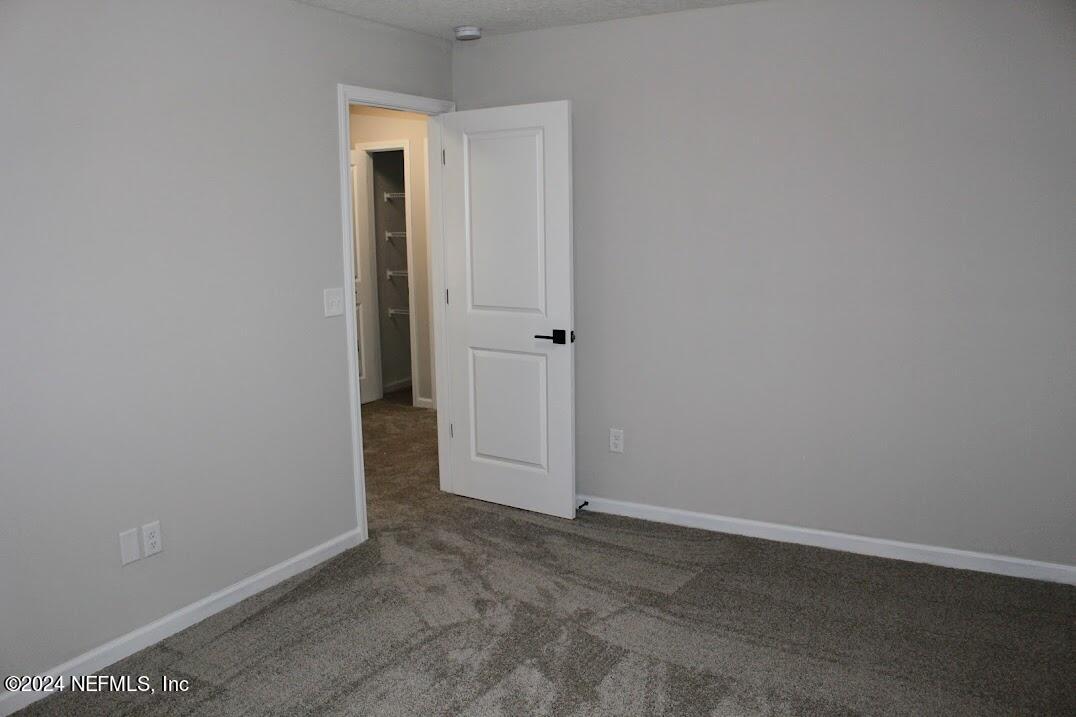 4152 Quiet Creek Loop, Unit 134 Middleburg, FL 32068 - Photo 12 of 42 an empty room with closet area