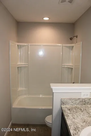 a bathroom with a bath tub
