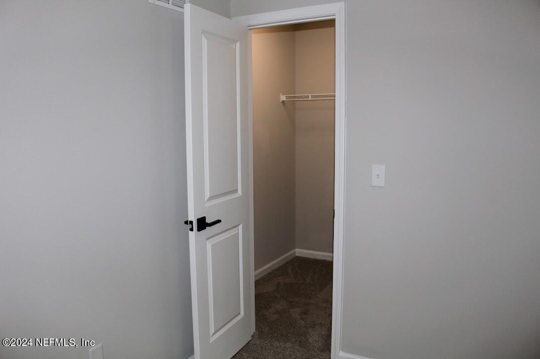4152 Quiet Creek Loop, Unit 134 Middleburg, FL 32068 - Photo 25 of 42 a view of a hallway with closet