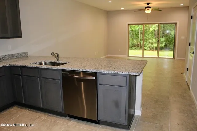a kitchen with a sink and a window