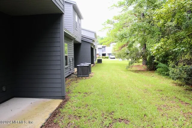 a view of a park with large trees