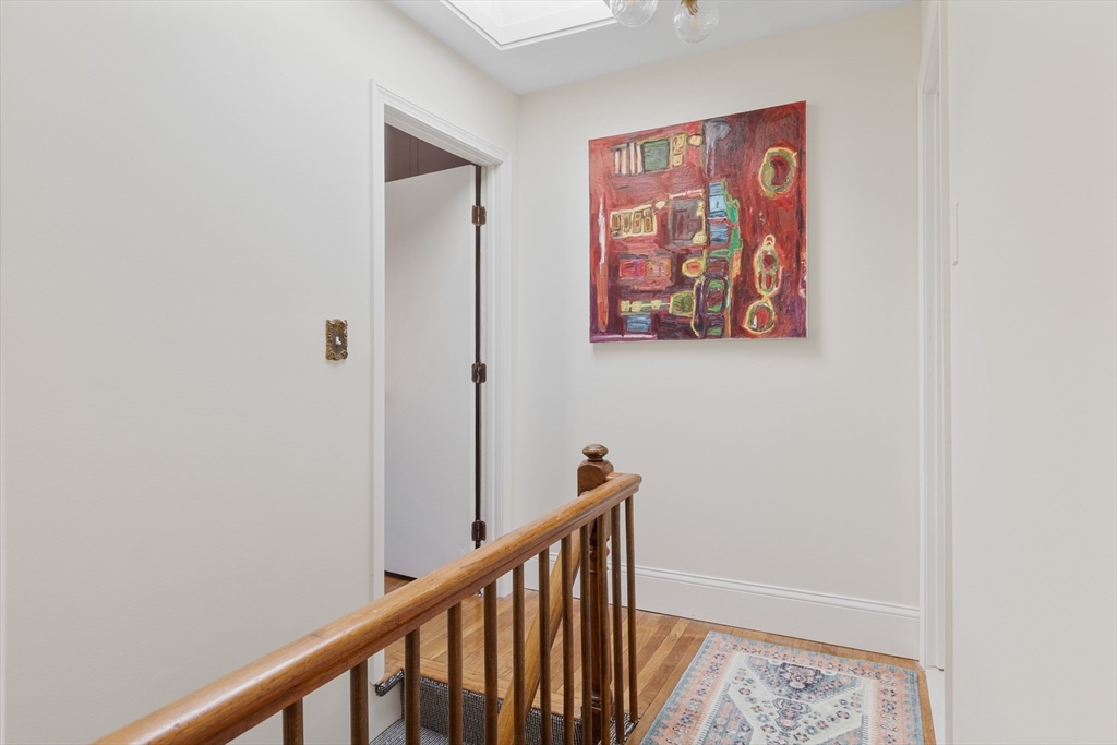 56 Spring Street, Unit 56 Cambridge, MA 02141 - Photo 9 of 14 a view of a hallway with a elevator