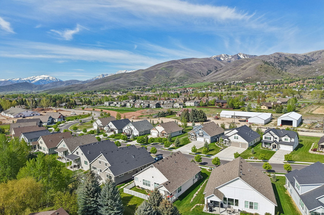 1238 Canyon View Road Midway, UT 84049 - Photo 36 of 36 Expansive neighborhood surrounded by green landscaping and distant snow-capped mountains