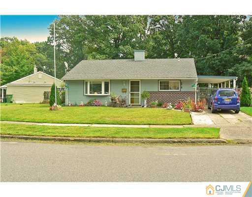123 Winthrop Road Edison, NJ 08817 - Photo 2 of 22 a front view of a house with a garden