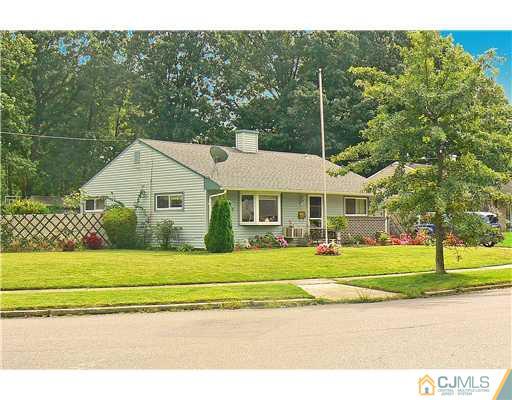 123 Winthrop Road Edison, NJ 08817 - Photo 3 of 22 a front view of a house with a yard