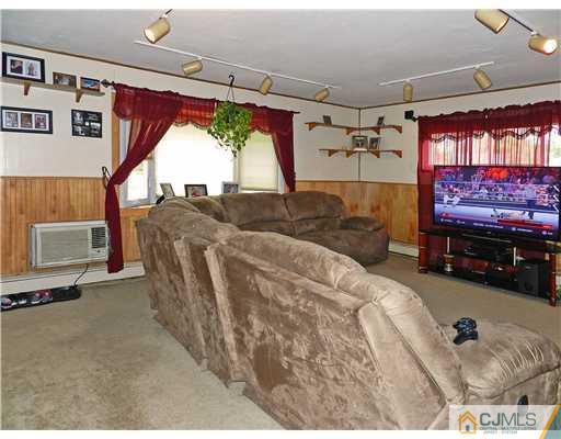 123 Winthrop Road Edison, NJ 08817 - Photo 8 of 22 a bed room with a bed and a couch