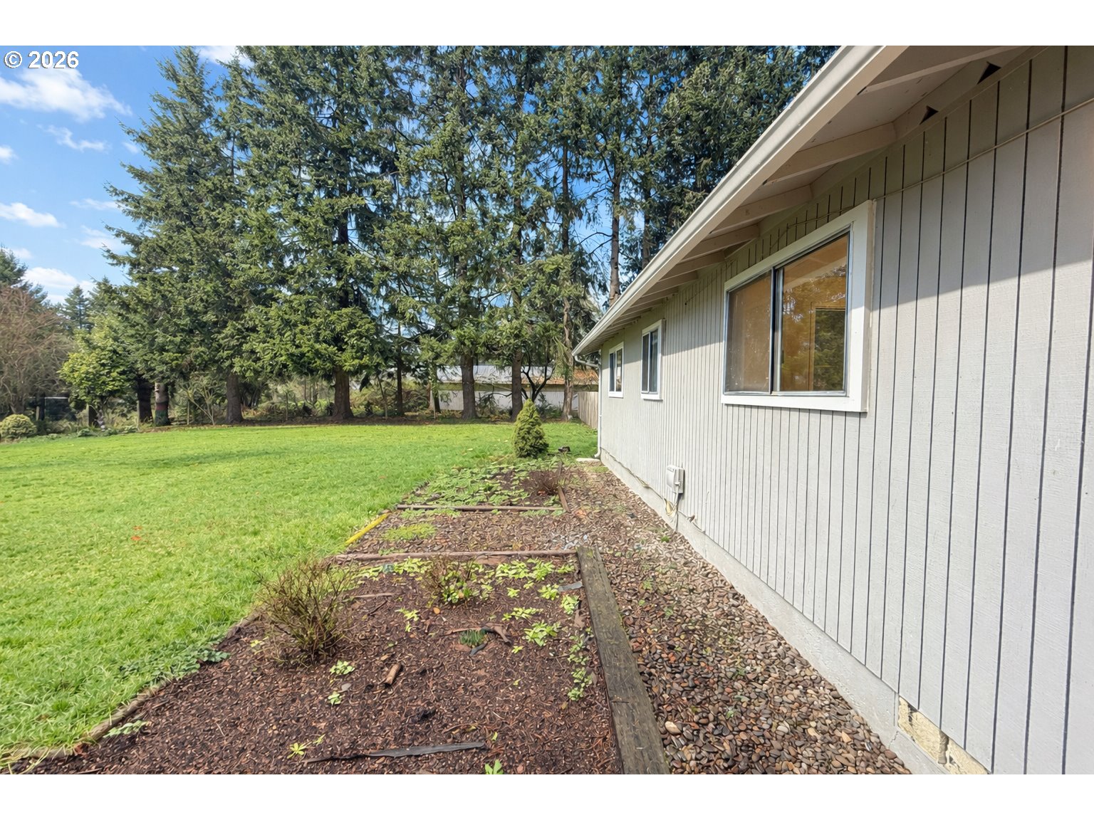 200 Roth Avenue Amity, OR 97101 - Photo 3 of 13 a view of a backyard with a garden