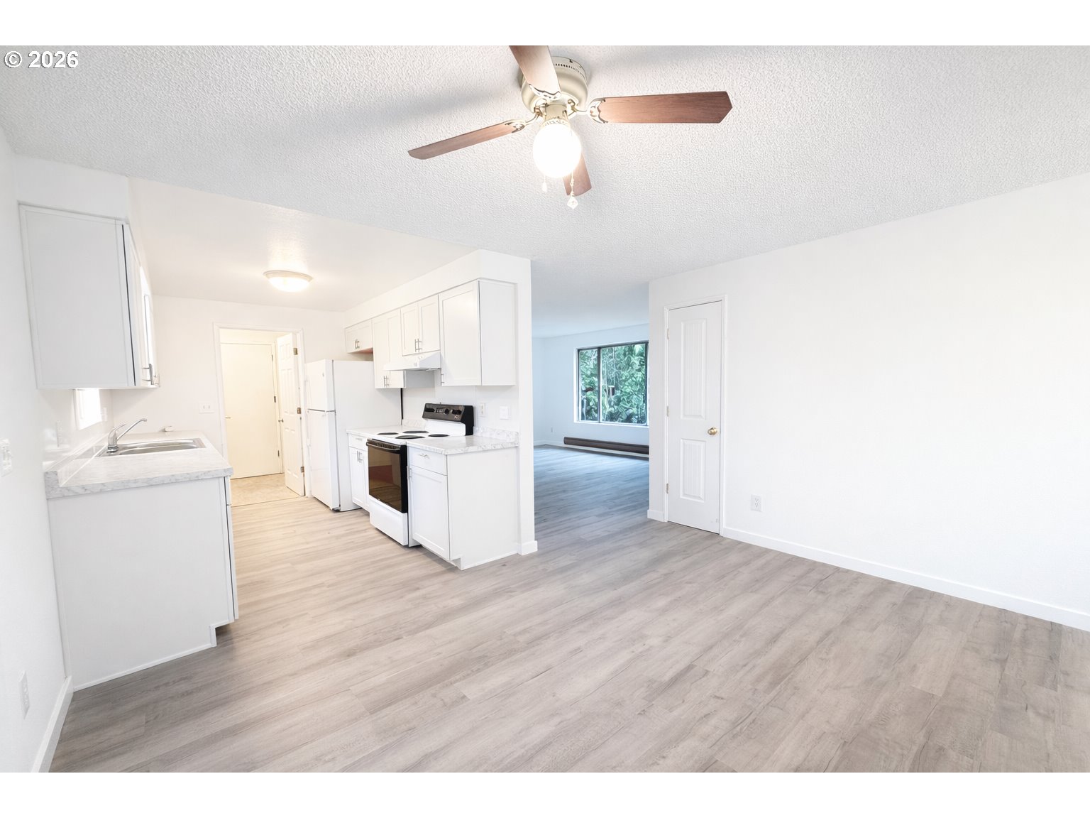 200 Roth Avenue Amity, OR 97101 - Photo 6 of 13 a view of kitchen with granite countertop cabinets and refrigerator
