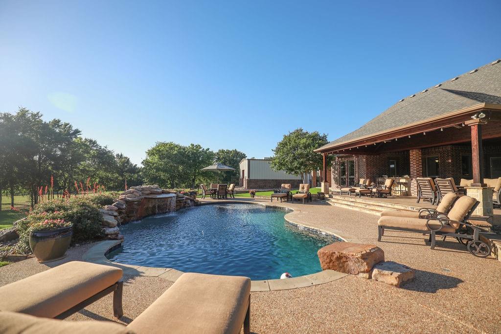 1387 Shadow Lakes Drive Wills Point, TX 75169 - Photo 4 of 33 a view of a swimming pool and lounge chair