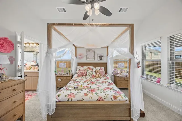 a living room with furniture and large window